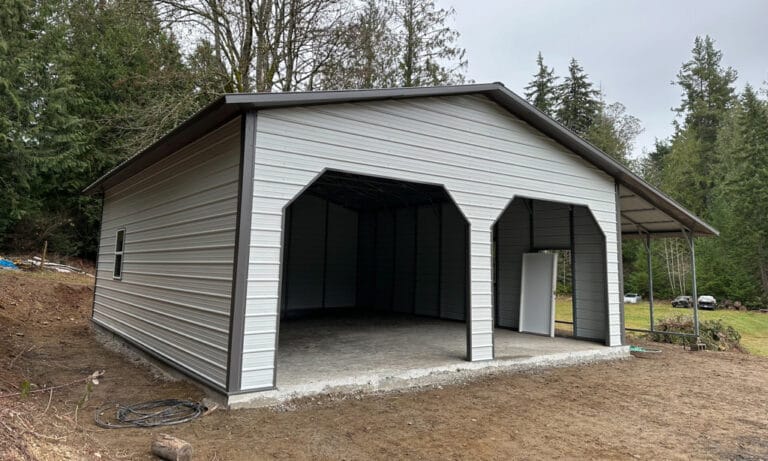 New metal garage in forested area