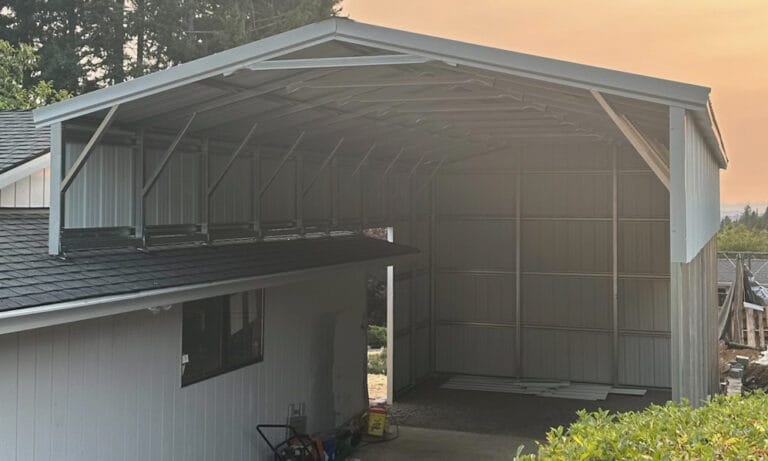 Metal carport attached to house, open space underneath.
