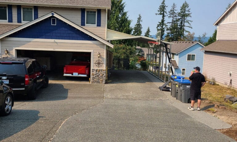 Suburban home with driveway and parked vehicles