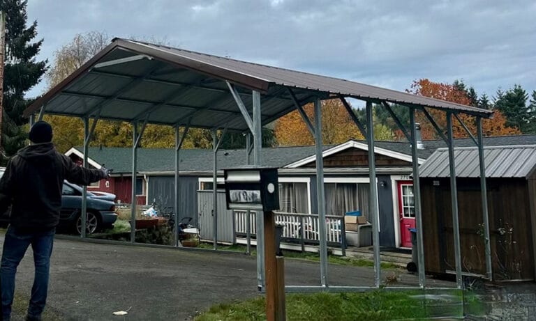 Metal carport in front of residential house.
