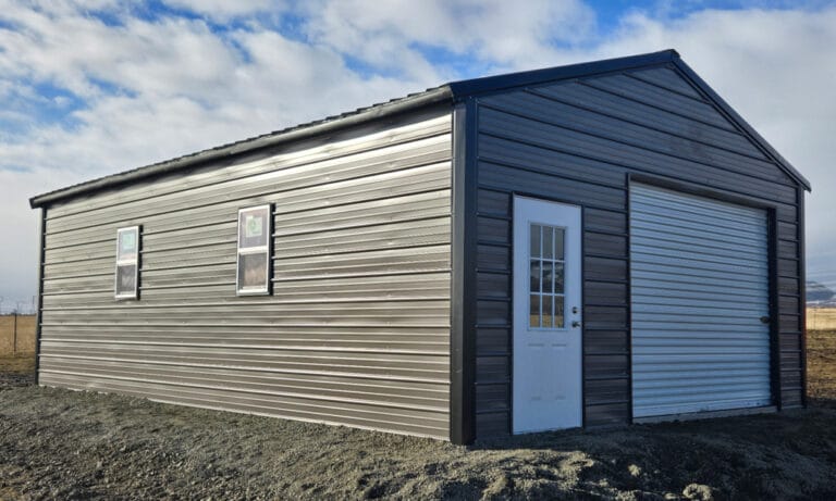 Metal storage shed with garage and side door.