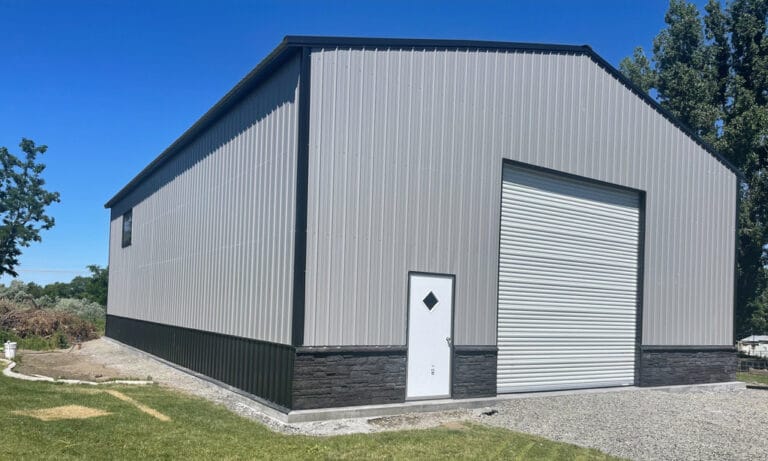 Large metal warehouse with roller door entrance.
