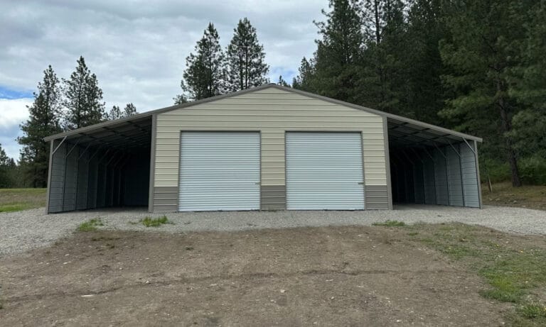 Metal shed with two closed doors in forested area.