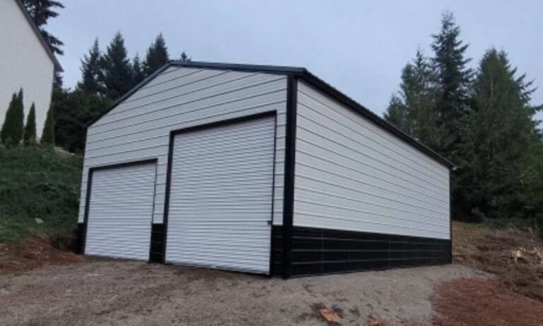 Metal garage with two roll-up doors