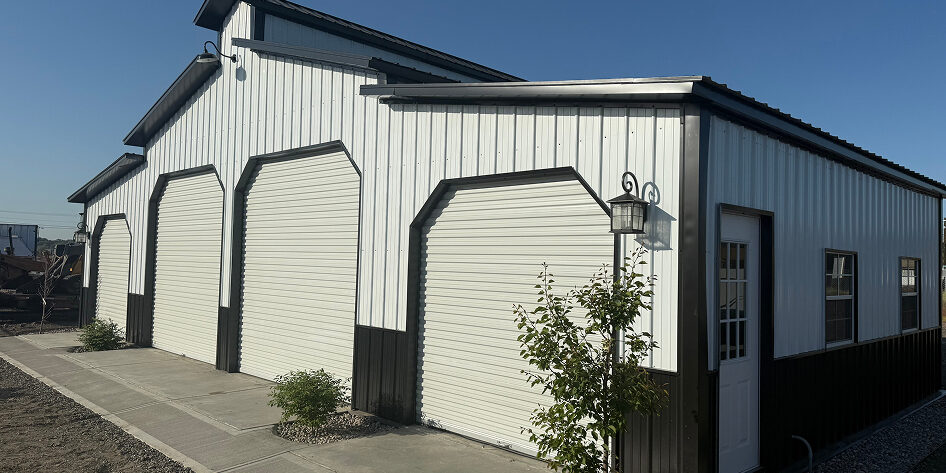 Metal building with open garage doors
