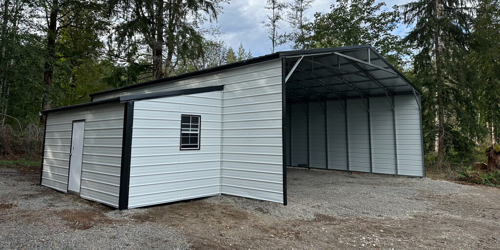 Metal building structure in wooded area